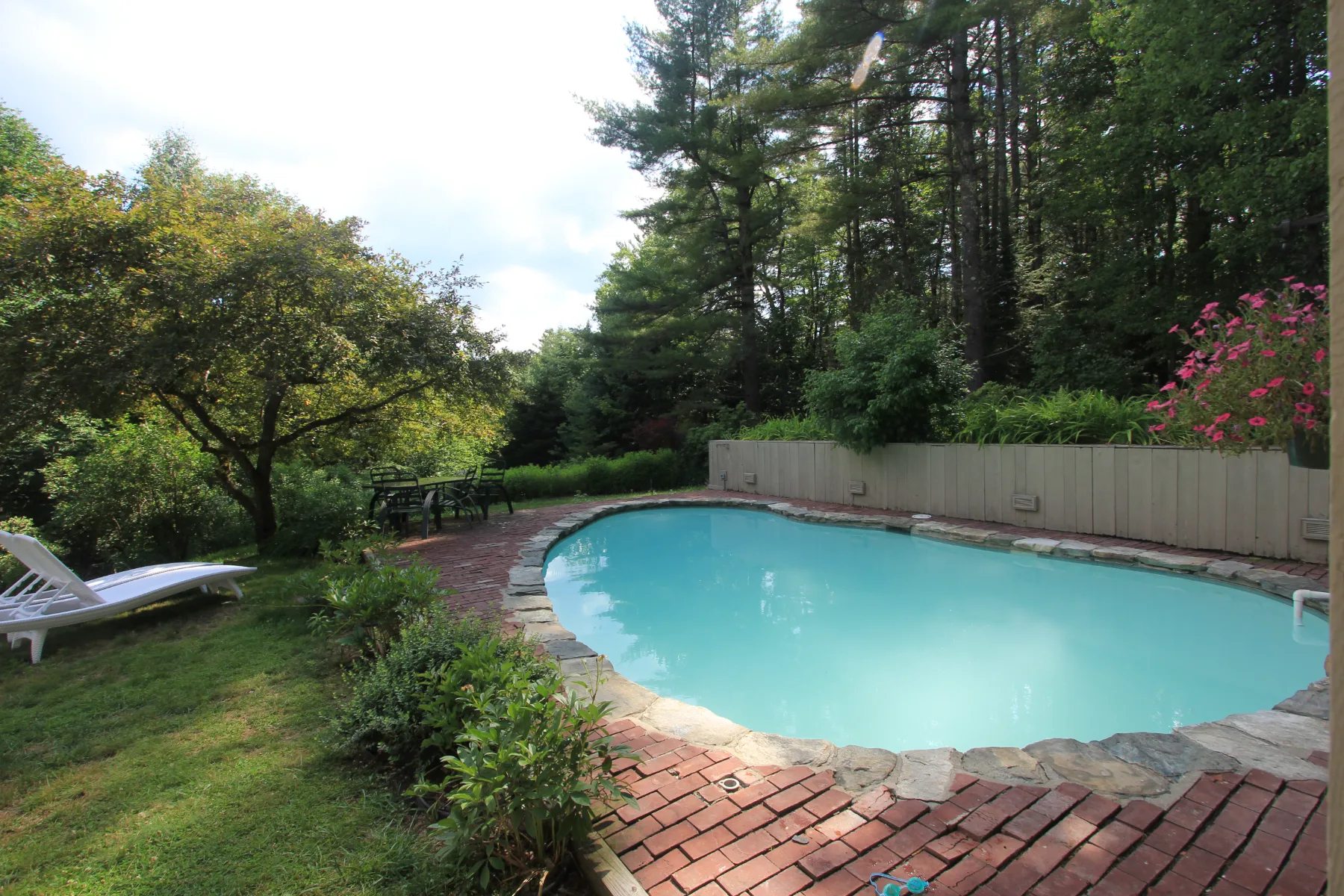 The heated outdoor pool set into the garden