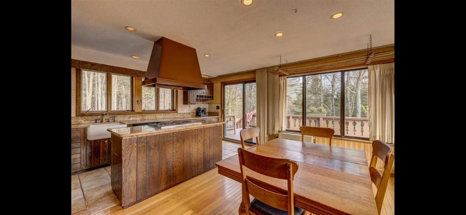 The kitchen island with the deck view beyond